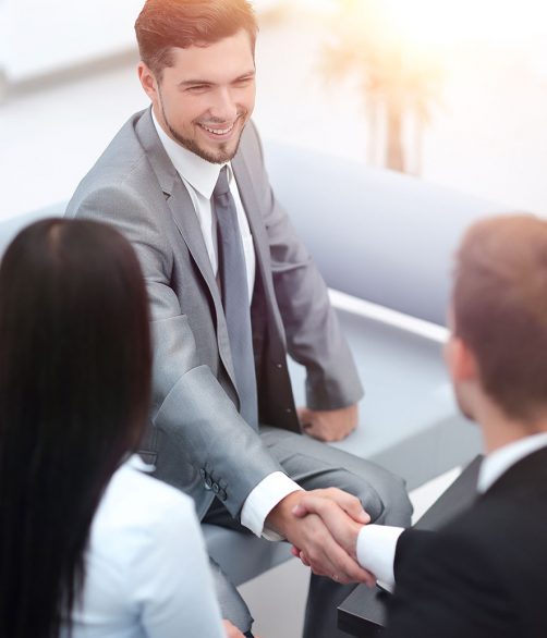 handshake business partners in the lobby of the office. photo with copy space